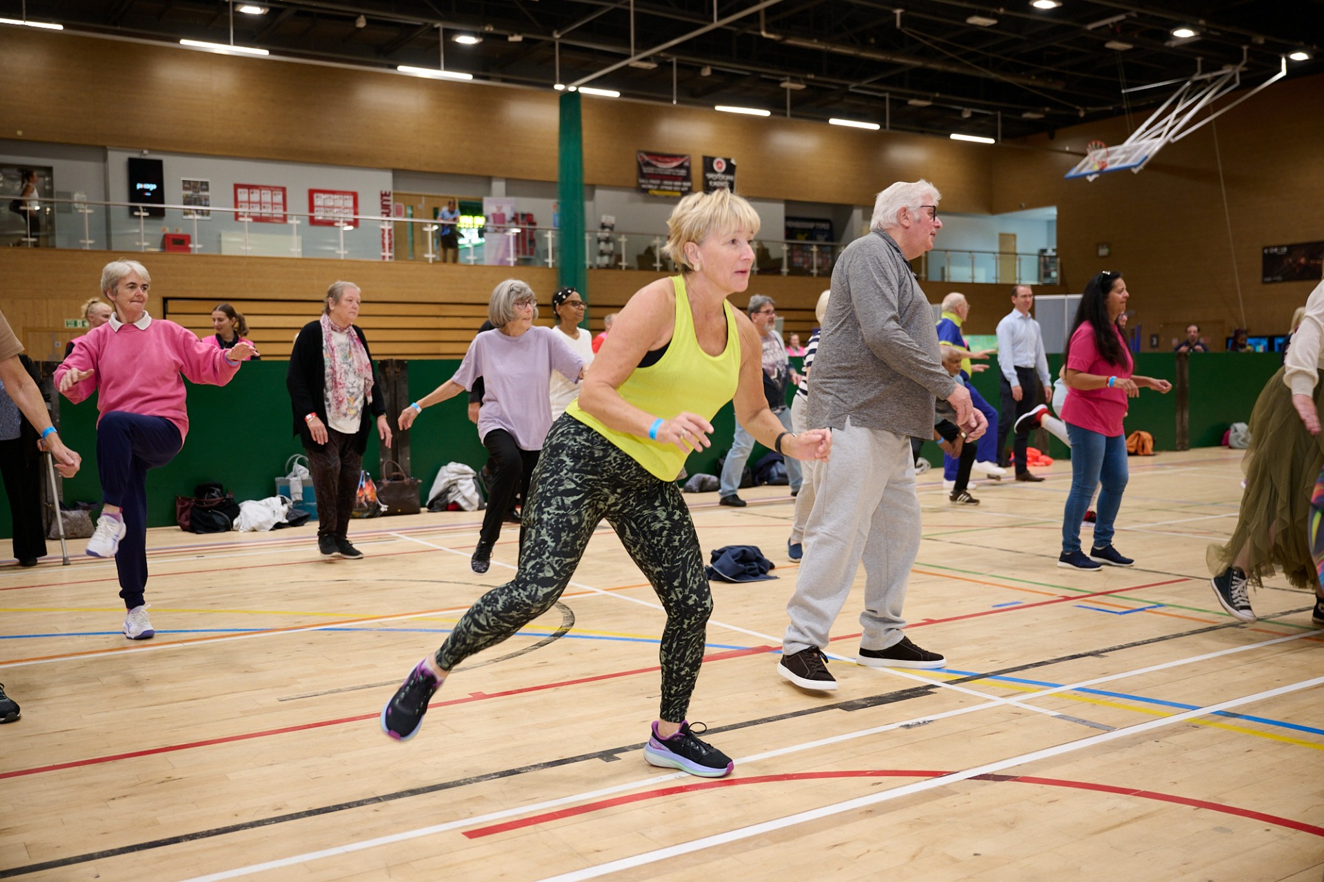Attendees participating in the warm-up led by Everyone Active staff